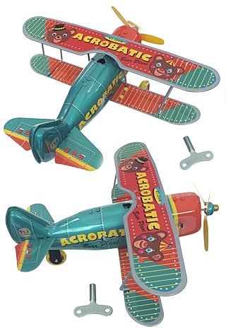 Acrobatic Bear Airplane Wind Up Tin Toy